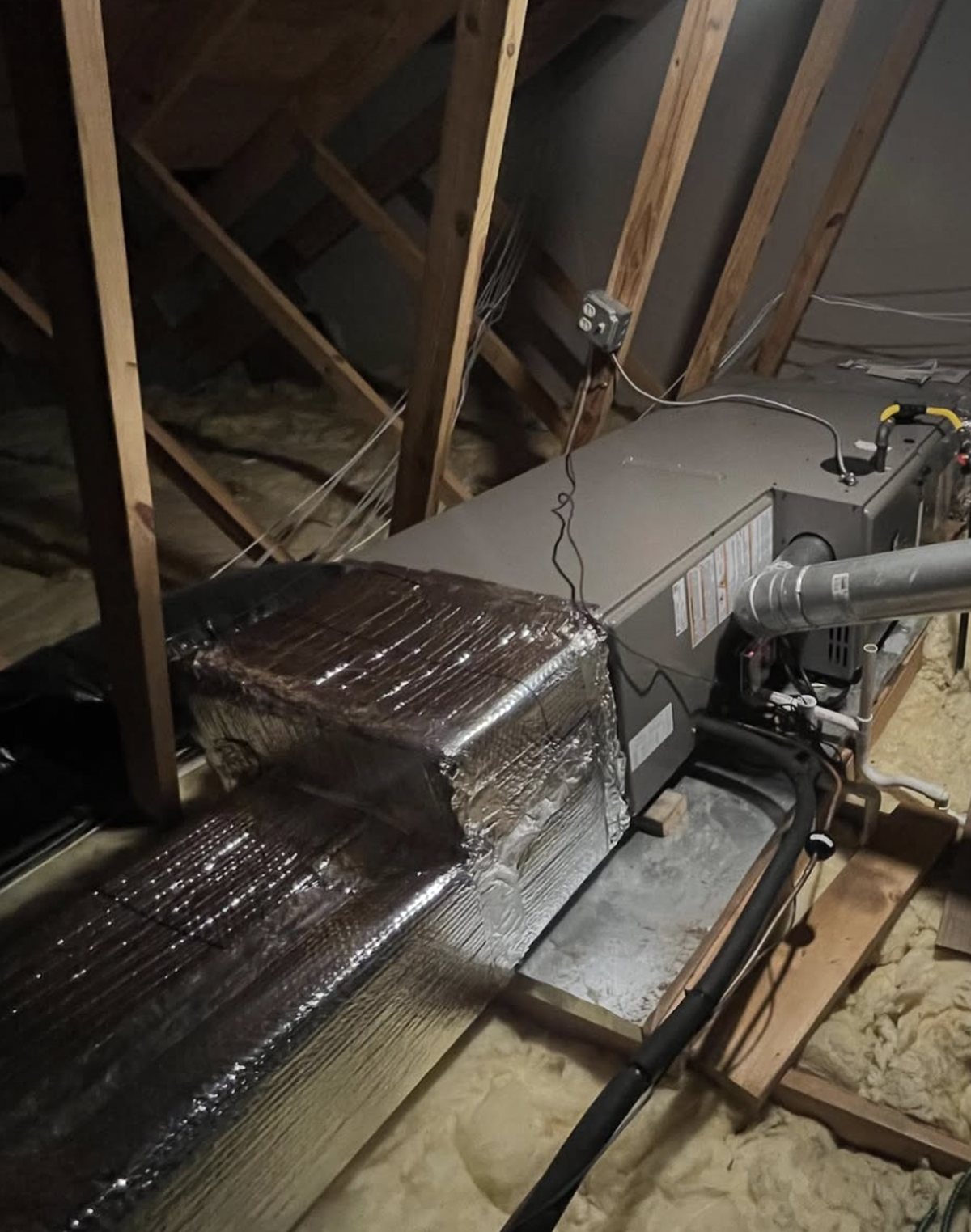 New furnace installed in an attic with insulated supply plenum connected