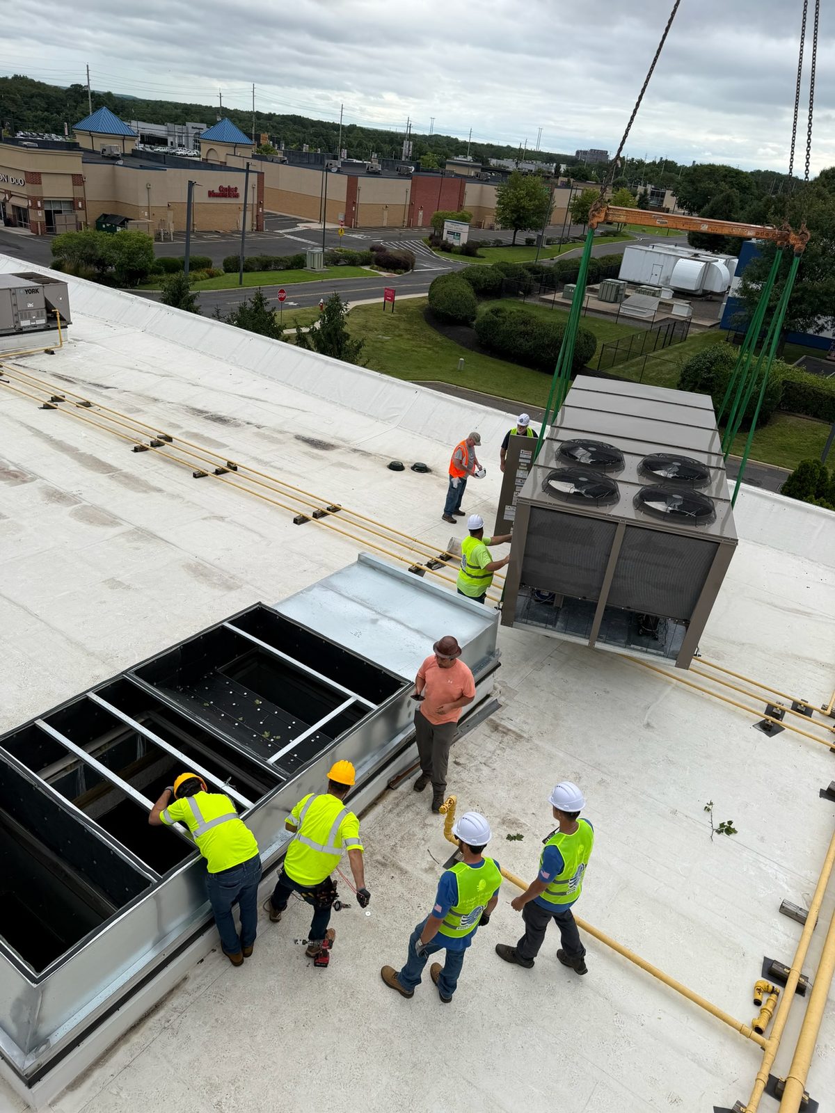Multiple rooftop units installed on a commercial building