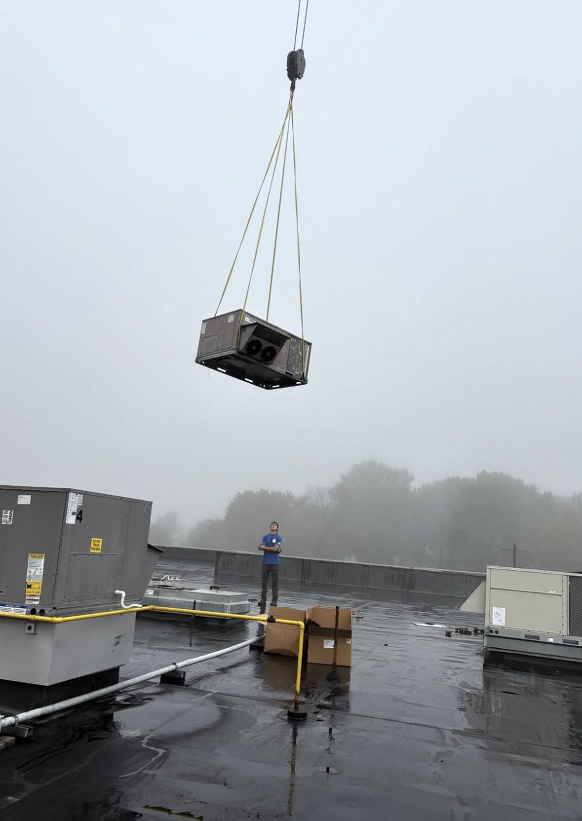New rooftop unit lowered onto the roof of a retail center in Mount Laurel, New Jersey